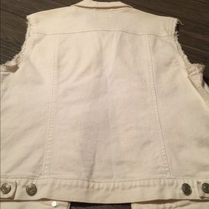 White jean sleeveless vest